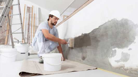 Couvrir une surface d'une couche de badigeon